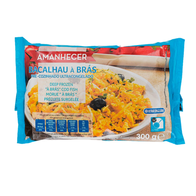 A package of Amanhecer Bacalau a Brás deep frozen cooked cod fish, featuring a blue wrapper with a photo of the prepared yellow-orange fish dish on a white plate.