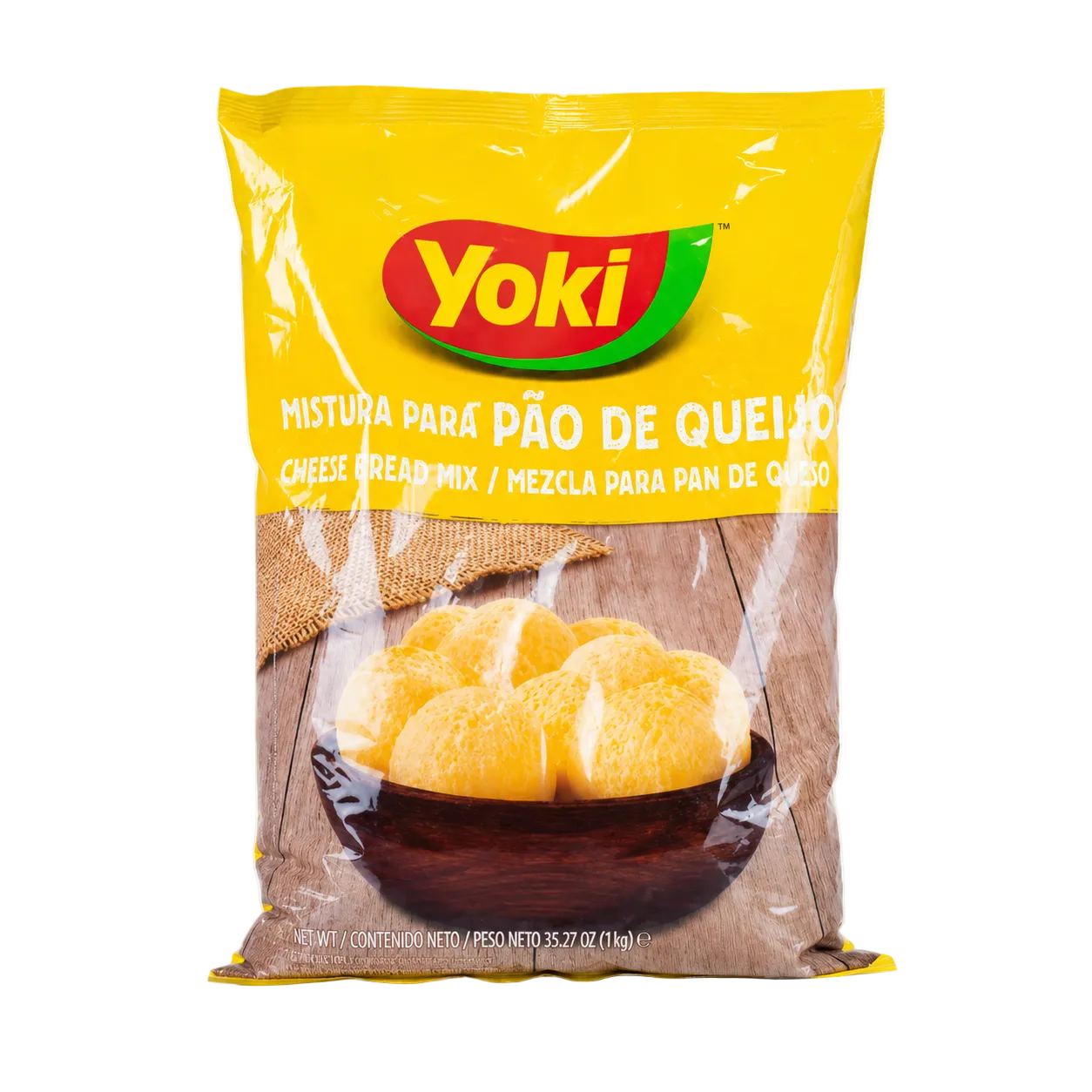 A bag of Yoki Cheese Bread Mix (Mistura para Pão de Queijo) on a clean white background. The packaging is primarily bright yellow with a red and green Yoki logo, and a photo of golden-brown cheese bread rolls in a dark wooden bowl near the bottom.
