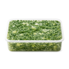 Frozen green vegetable mix in a clear plastic container on a white background